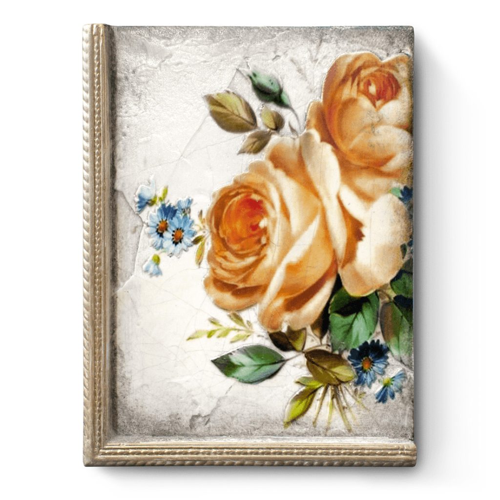 A white sculptural block with a vintage illustration of a bouquet of flowers and a 3d Gold frame section on it. The flowers are golden orange roses and a small blue flower with green foliage and they are on the right side of the block. The left and bottom edge of the block have a 3D gold frame section on it.